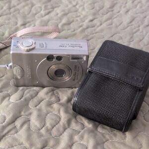 Canon  PowerShot S100 Digital Elph Silver Digital Camera with Black Case